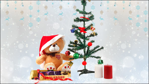 Ornamented Christmas Tree, Teddy Bear, Santa Cap, Toblerone, Cadbury Temptations, Cadbury Silk, 2 Aroma Candles Ornamented Christmas Tree, Teddy Bear, Santa Cap, Toblerone, Cadbury Temptations, Cadbury Silk, 2 Aroma Candles