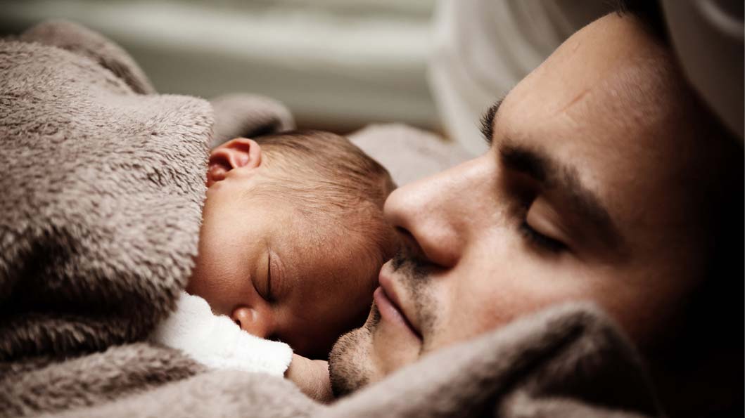 Daughter sleeping on warm chest of her father Daughter sleeping on warm chest of her father
