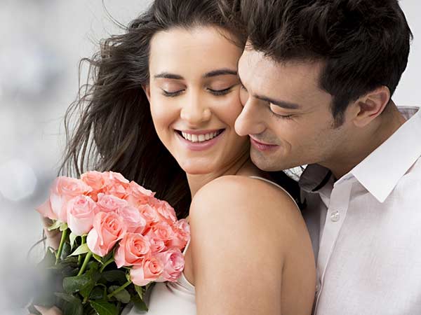 A Man Expressing His Feeling To A Girl By Giving Flowers A Man Expressing His Feeling To A Girl By Giving Flowers