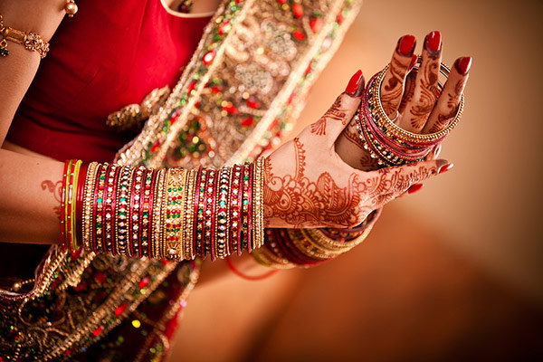 Wife getting ready for the day of karwa chauth Wife getting ready for the day of karwa chauth