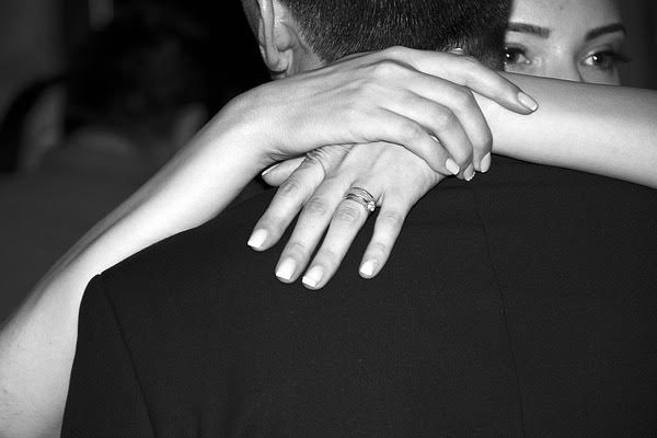 A girl expressing her love by giving hug to her loved one A girl expressing her love by giving hug to her loved one