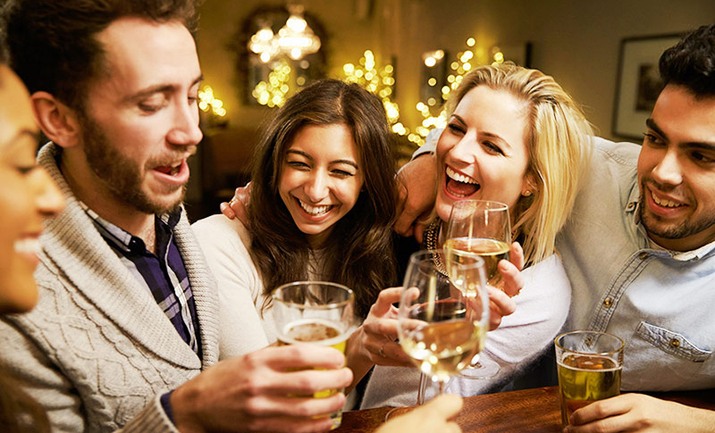 A beautiful couple enjoying a fun date night with other another couple A beautiful couple enjoying a fun date night with other another couple