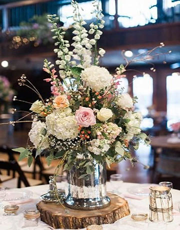 A bunch of flowers in a glass bottle A bunch of flowers in a glass bottle