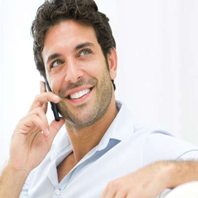 A Guy in conversation over phone with the women he loves the most